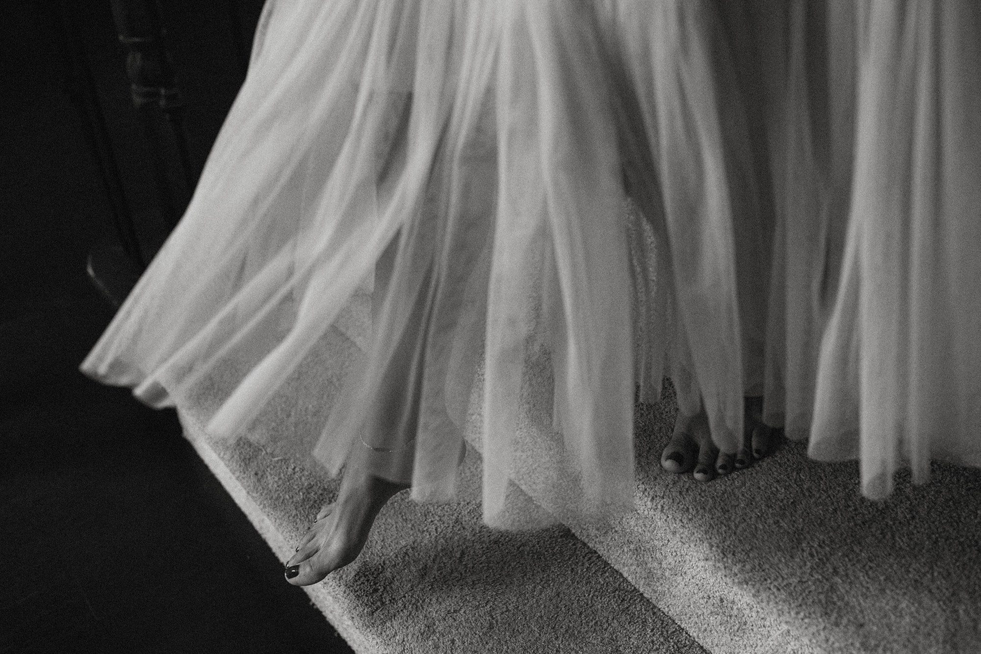 black and white image of a beautiful tulle dress in motion