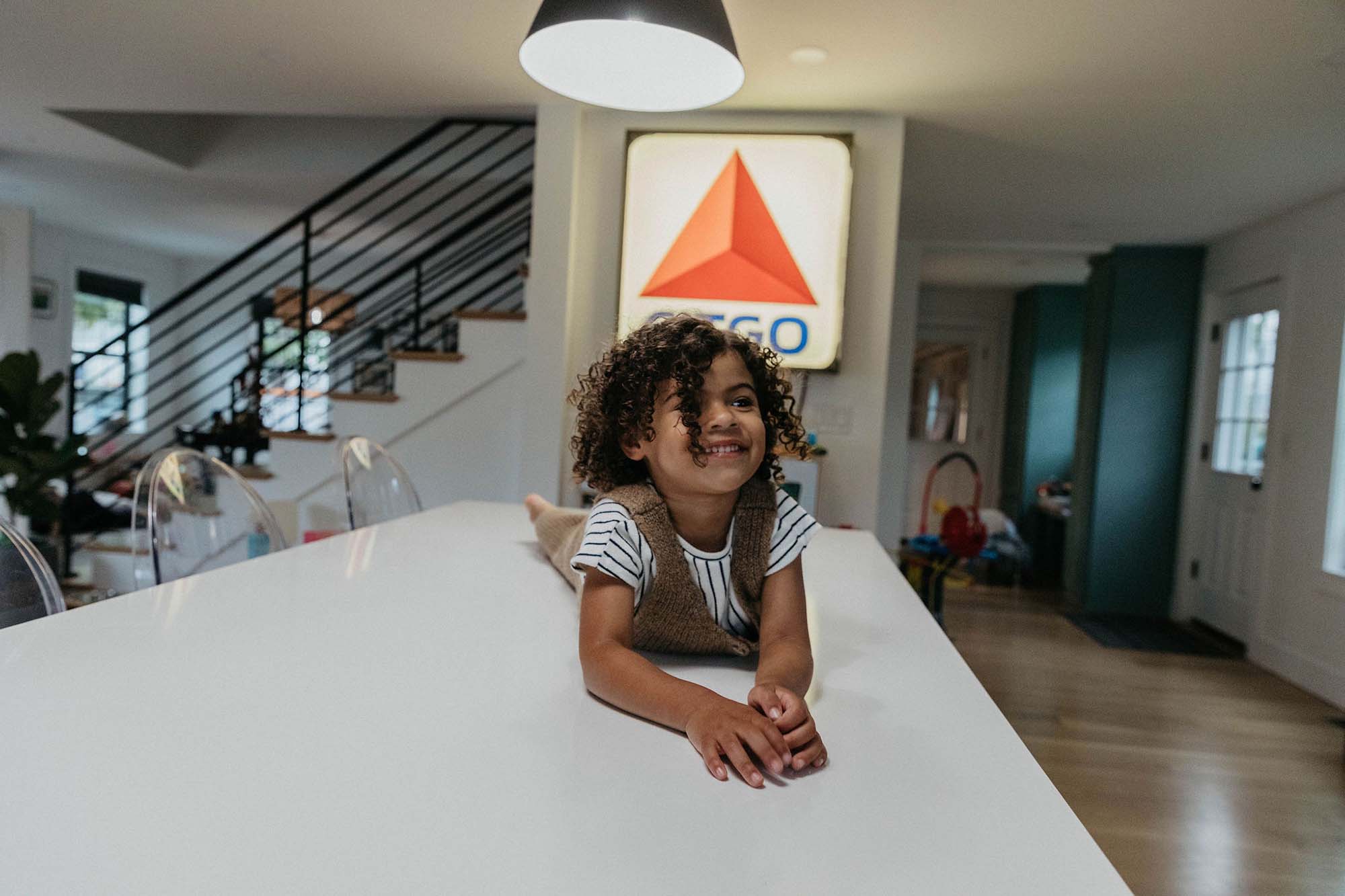 daughter little girl model portraits with boston citgo sign in kitchen.  family photo shoot at home. Boston area NYC family photographer 