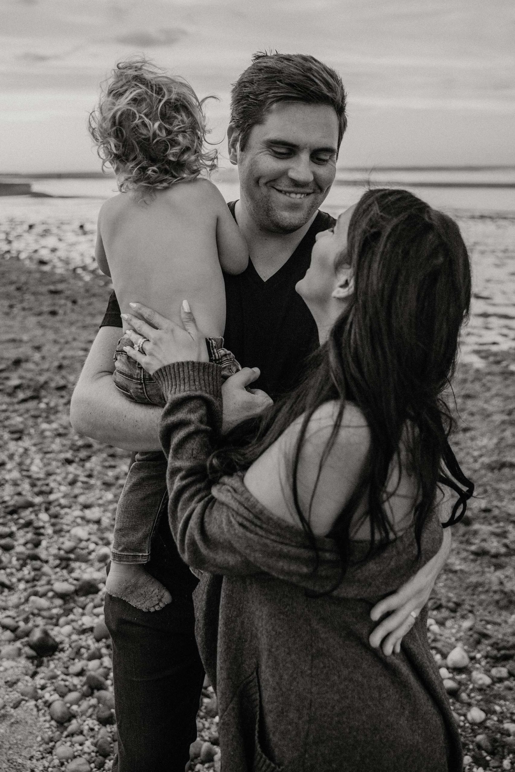 black and white family portrait, mother father and son smiling family photo, Long Island family photographer 