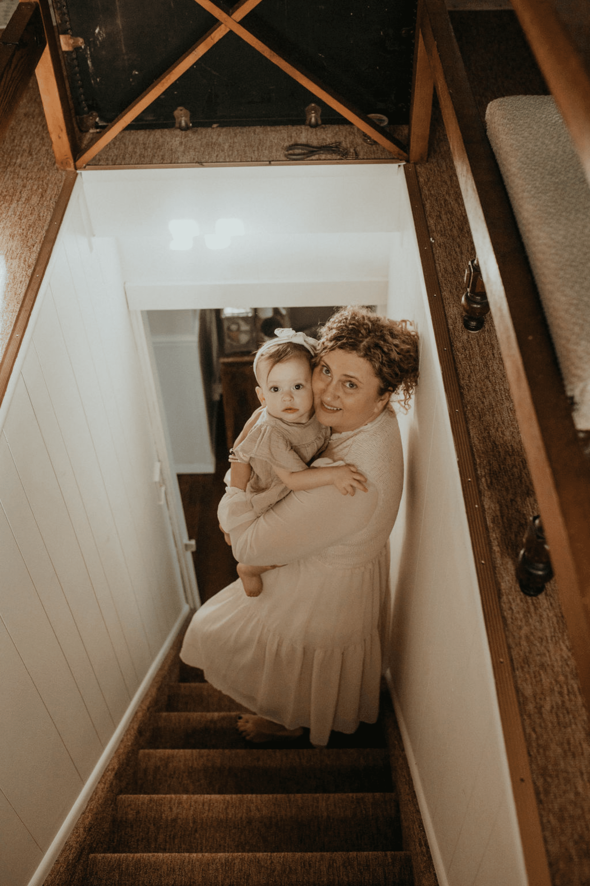 mommy and me moody family portraits on a staircase at home photoshoot. Long Island photographer 