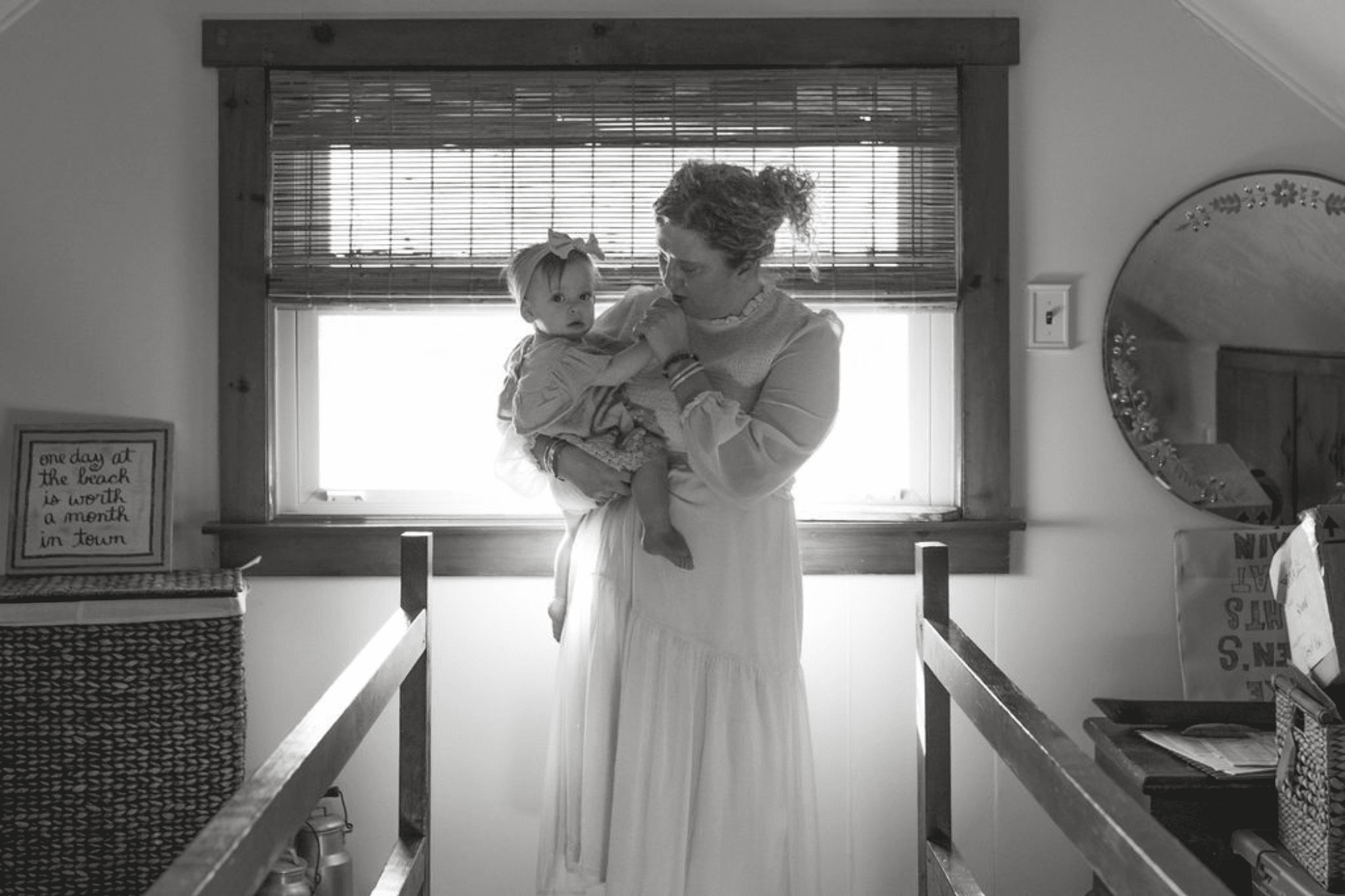 mommy and me moody black and white b&w beautiful family portraits on a staircase. at home photoshoot. Long Island photographer New York